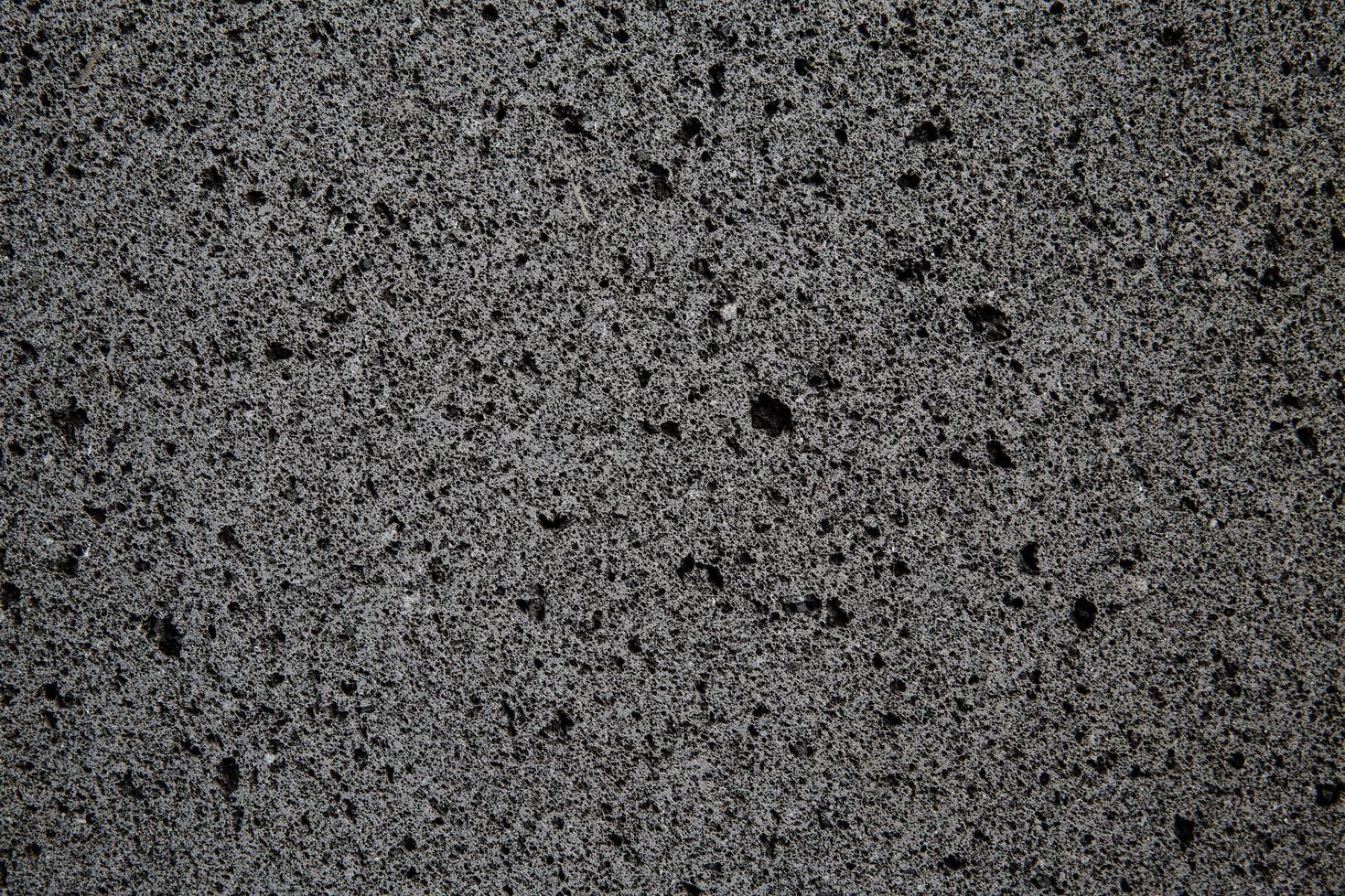 Rough stone surface with small pores photo