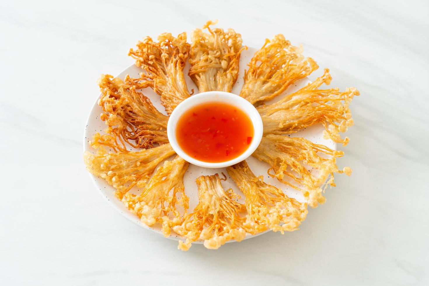 Fried enoki mushroom or golden needle mushroom photo