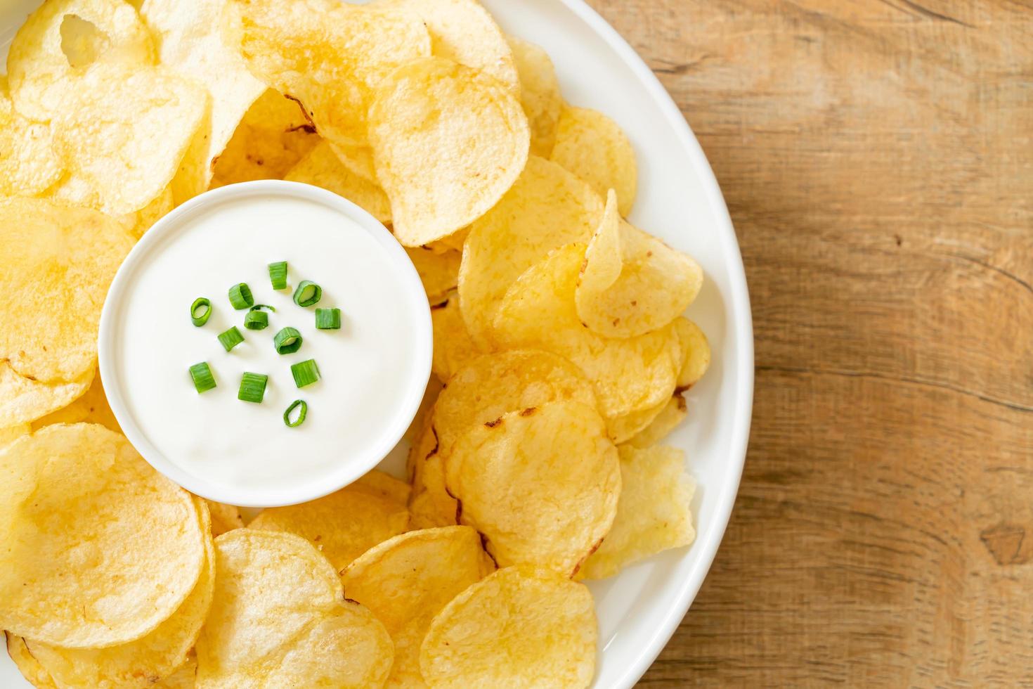 Potato chips with sour cream photo