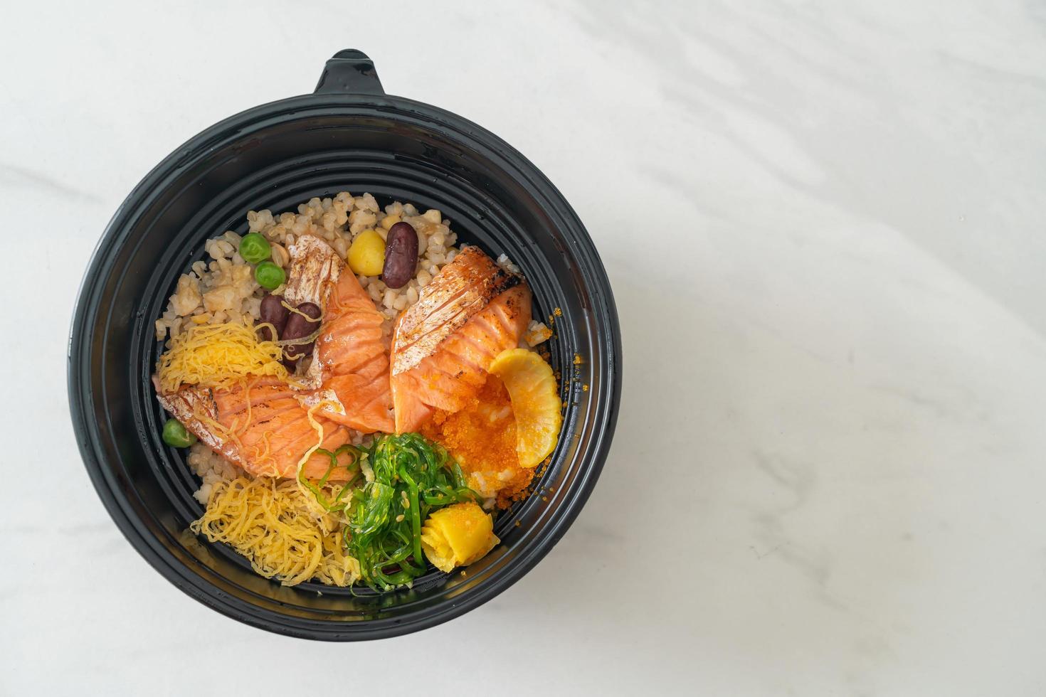 Grilled salmon with brown rice donburi photo