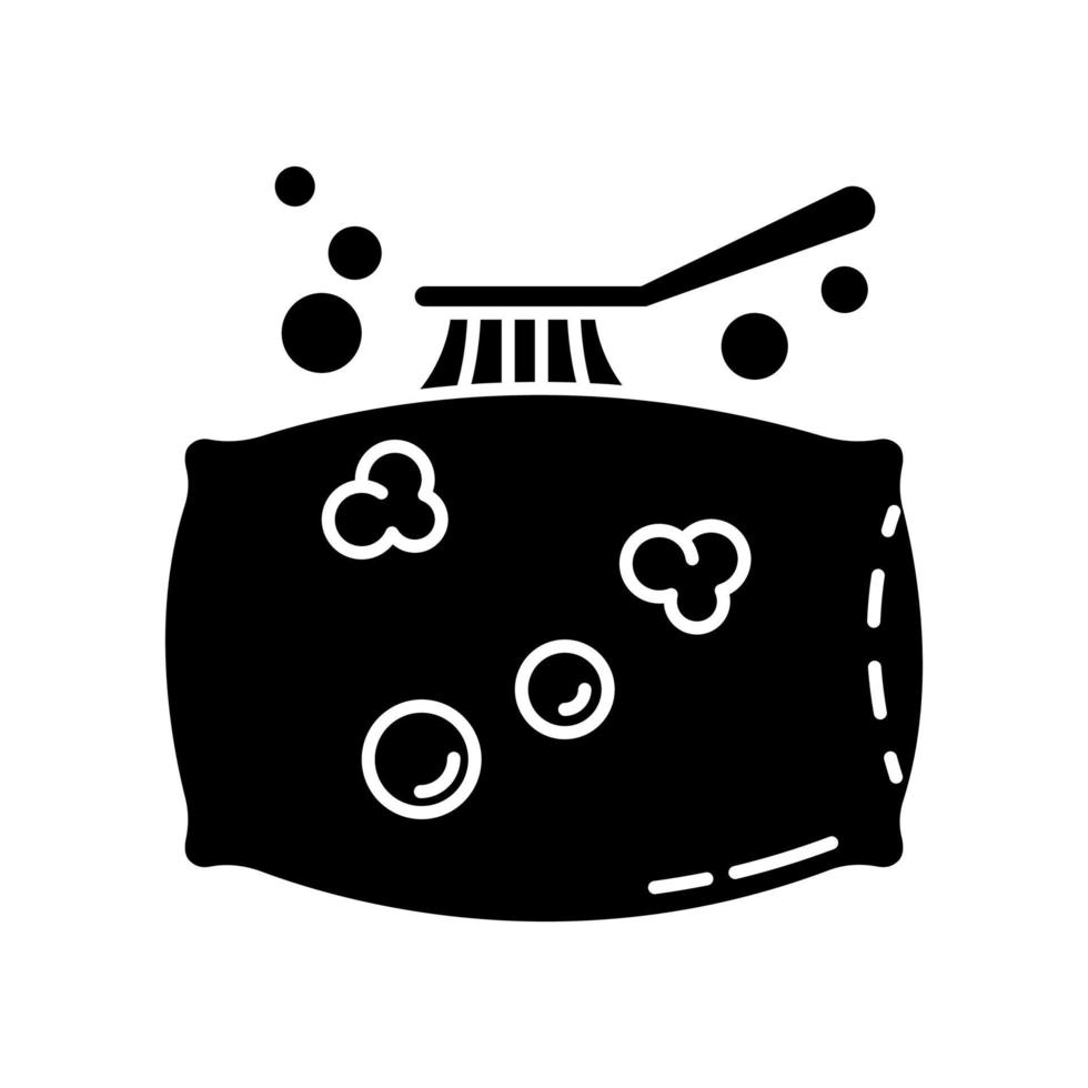 Pillow cleaning black glyph icon vector