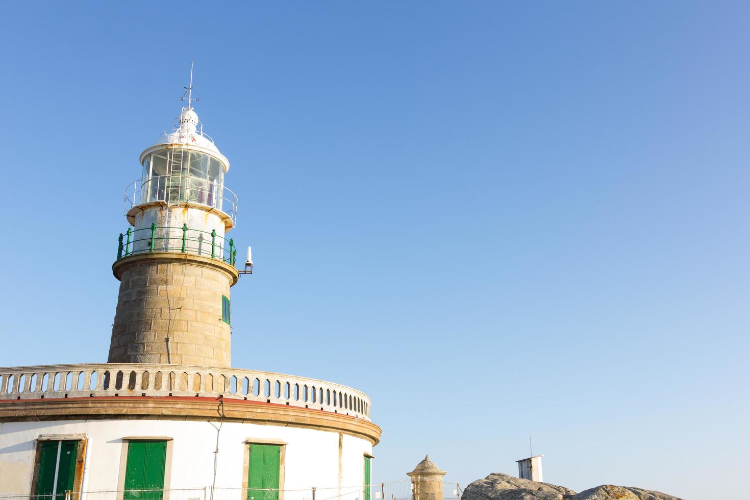 Corrubedo lighthouse in the Atlantic Ocean, Galicia, spain photo