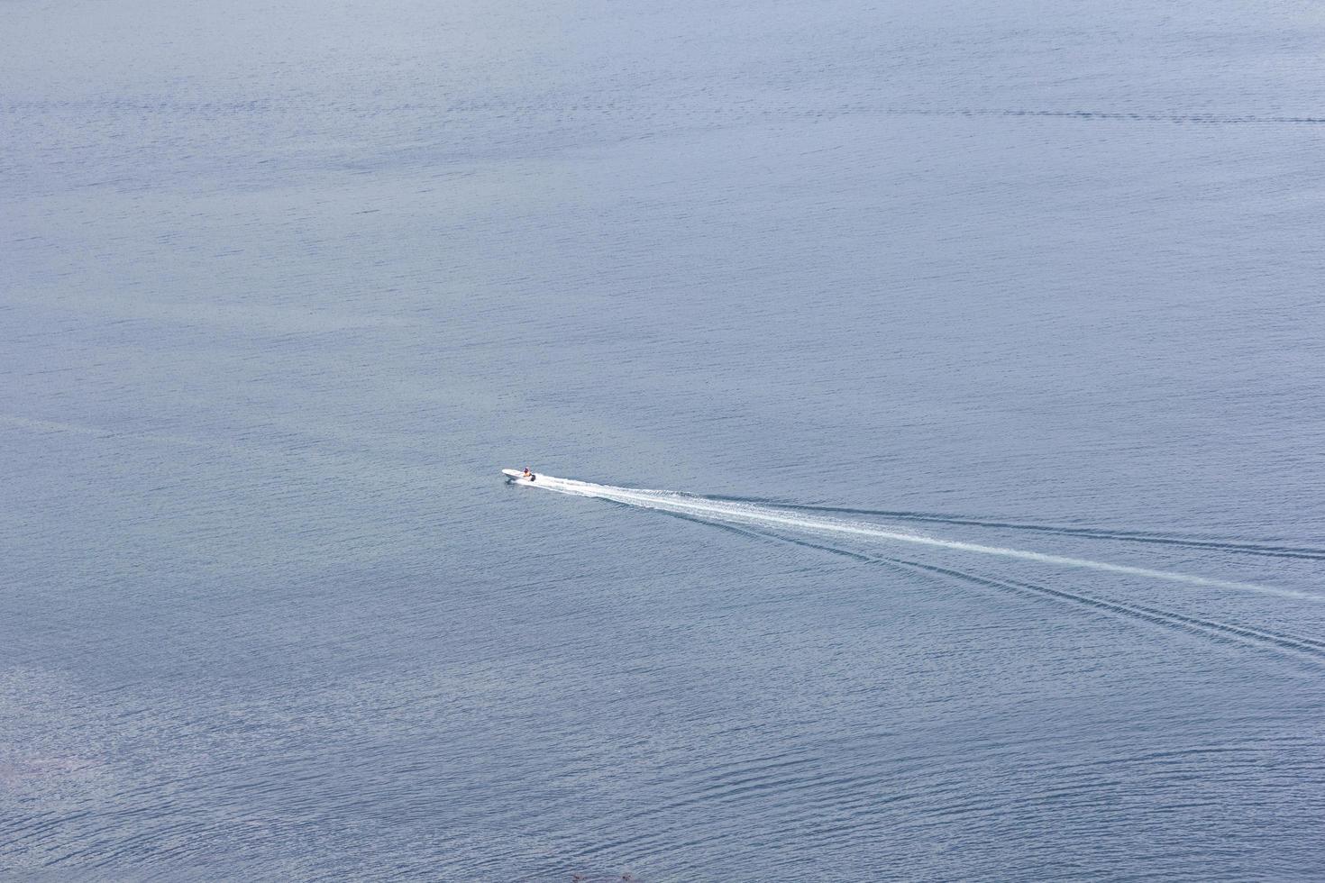 Boat wake in the ocean photo