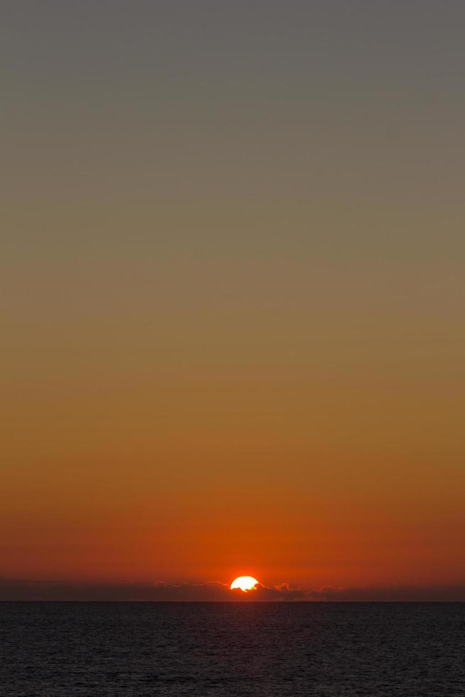 Sunset over the sea photo