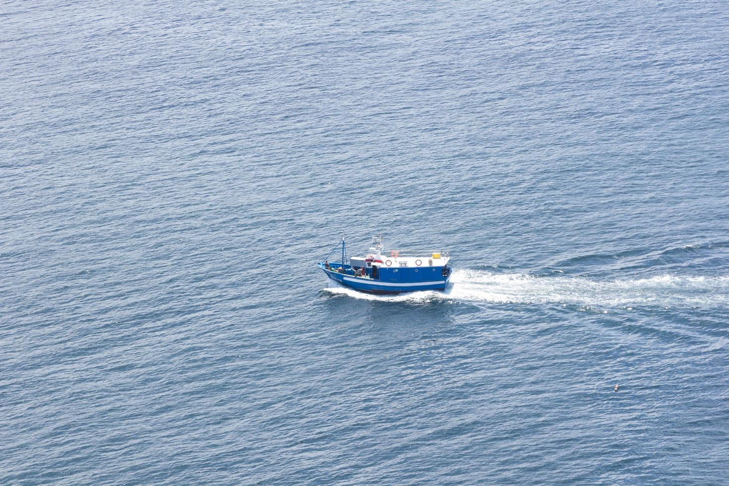 Fishing boat on the sea photo