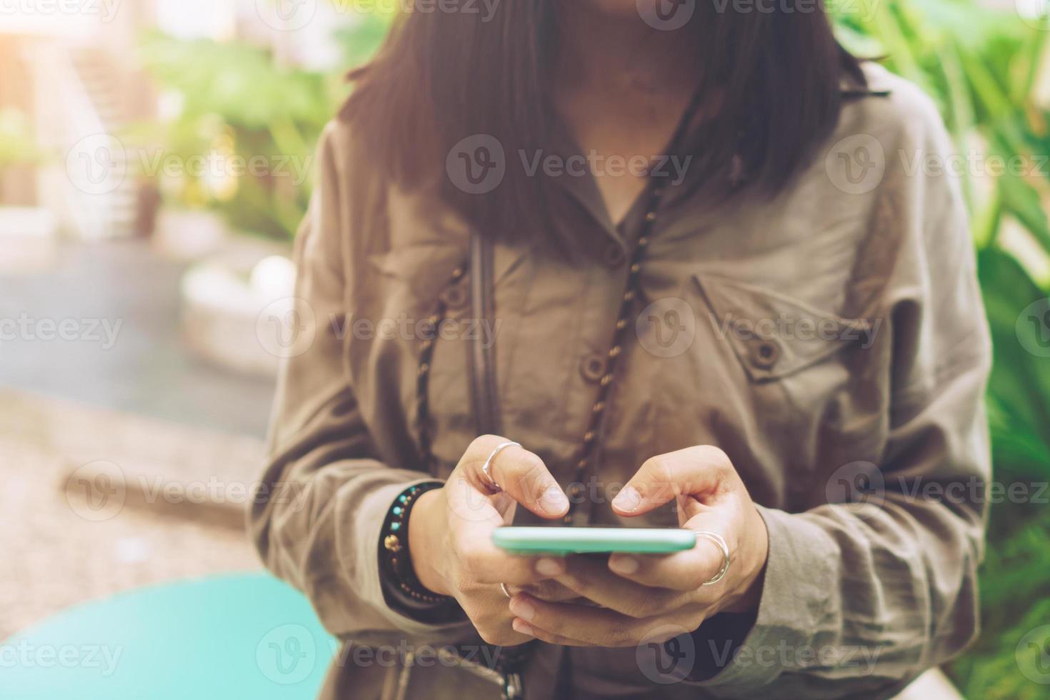 Woman hand using smartphone to do work business. photo