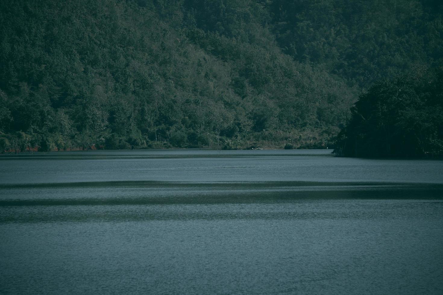 Lake and mountain background in thailand. Dark tone photo
