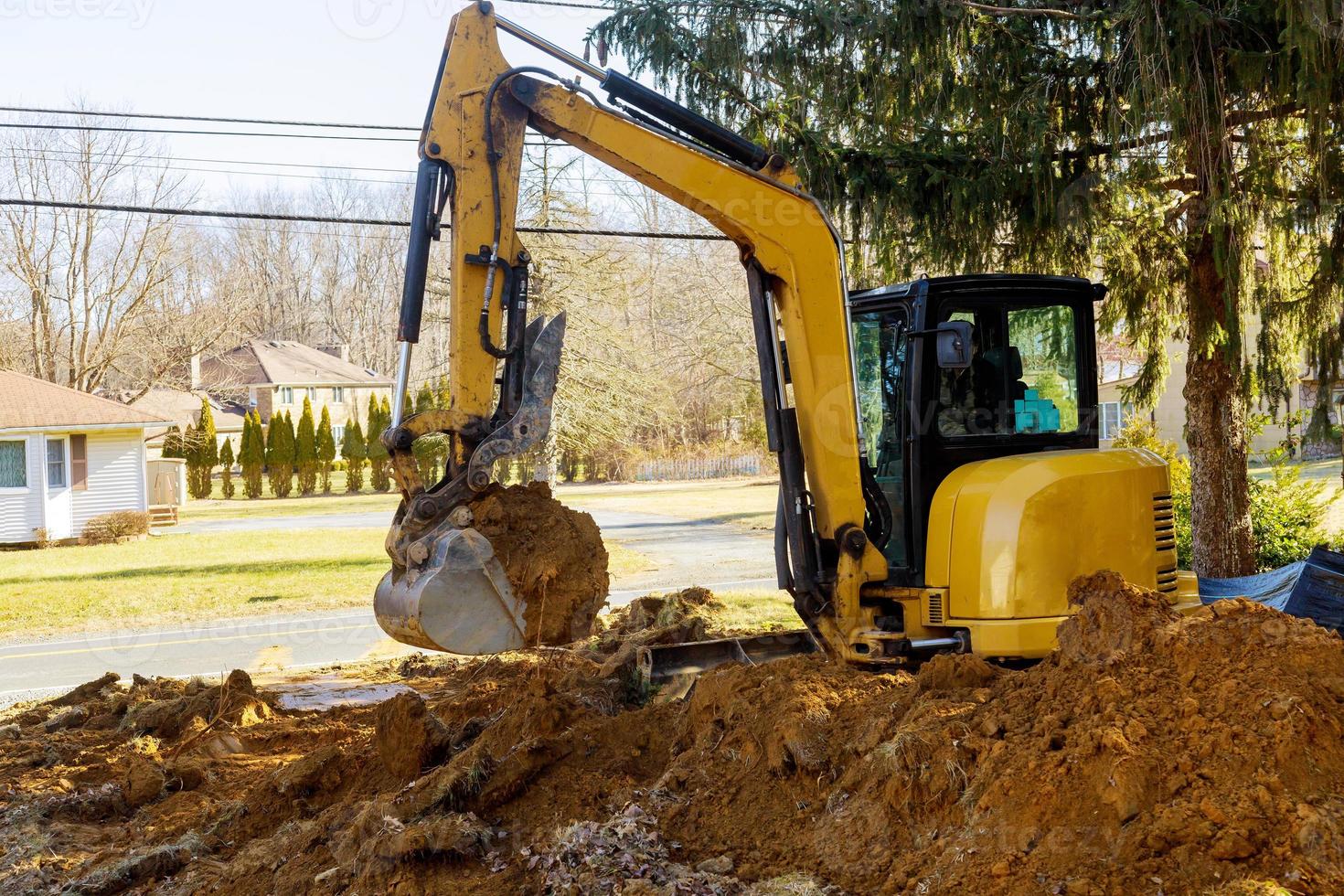 Excavator loader at earth moving works photo