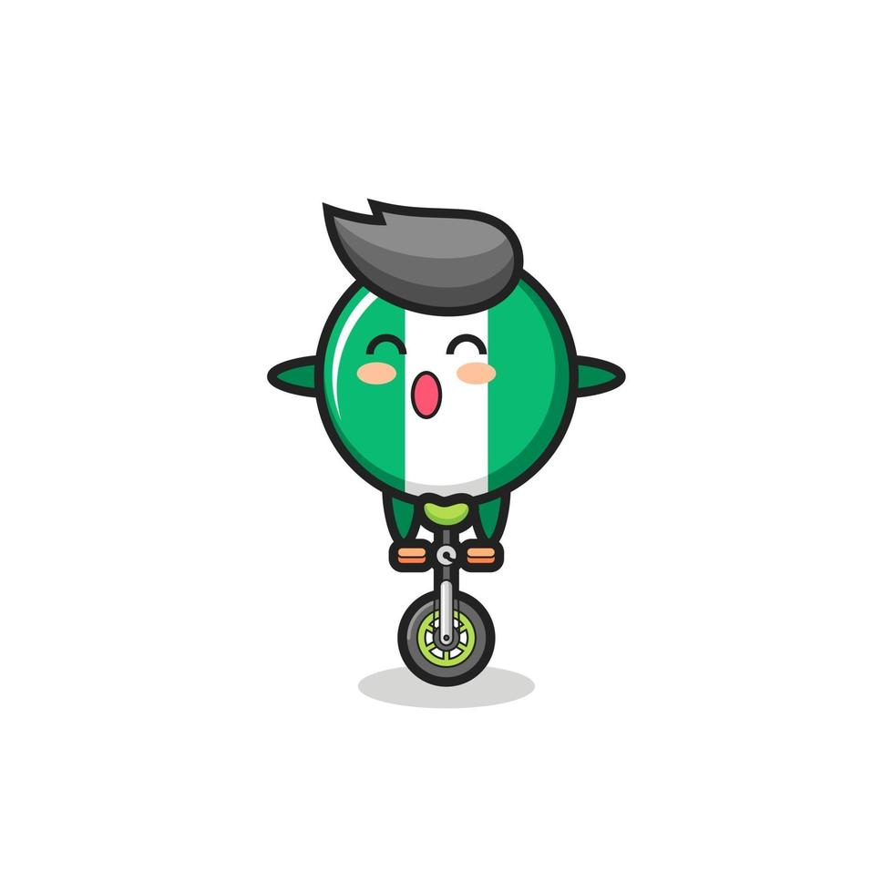 The cute nigeria flag badge character is riding a circus bike vector
