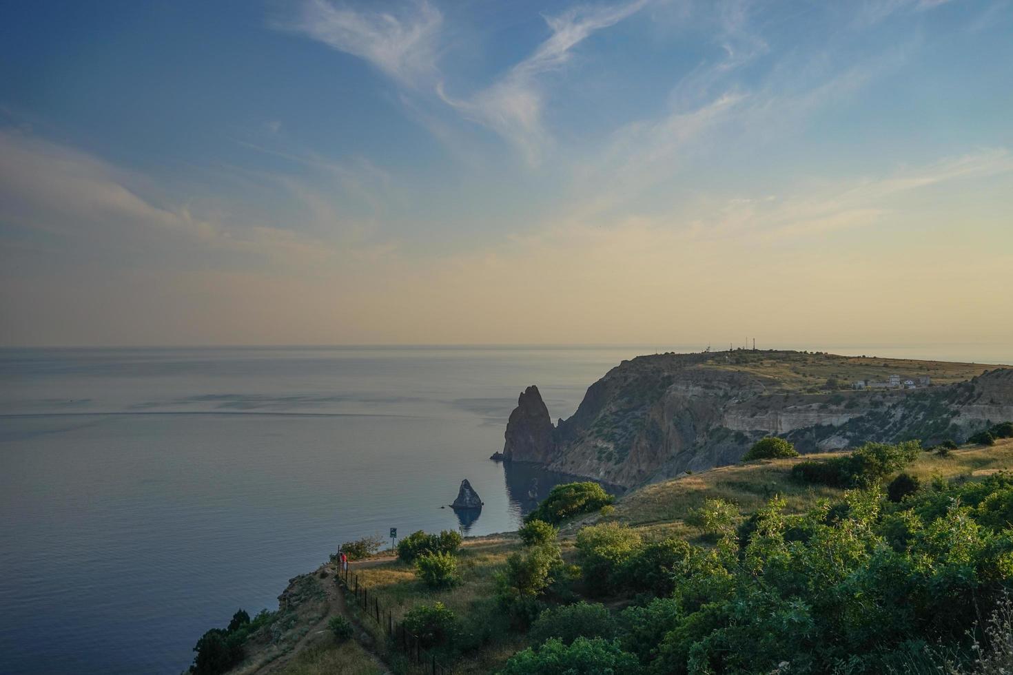 Seascape with coastline covered with vegetation. photo