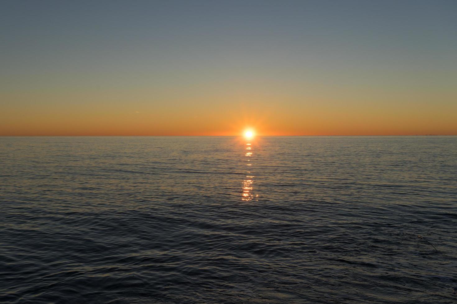 Seascape with a beautiful sunset over the water. photo