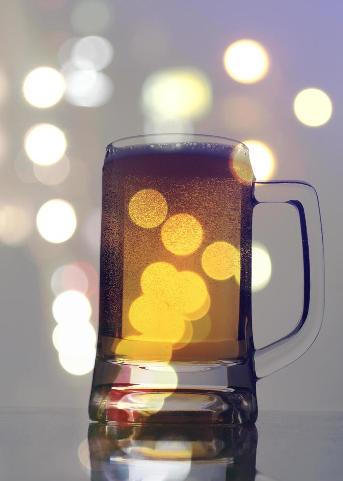 Beeer glass with spot lighting blur background for vintage concept photo
