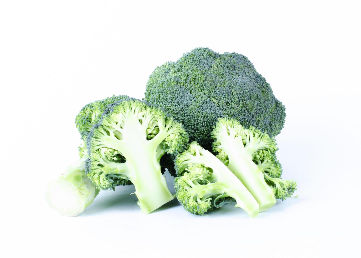 Broccoli vegetable sliced on white backgrounds photo