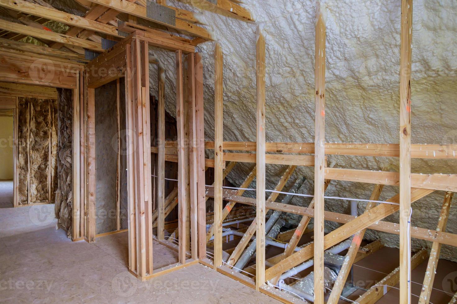 Foam plastic insulation installed in the attic of new frame house. photo