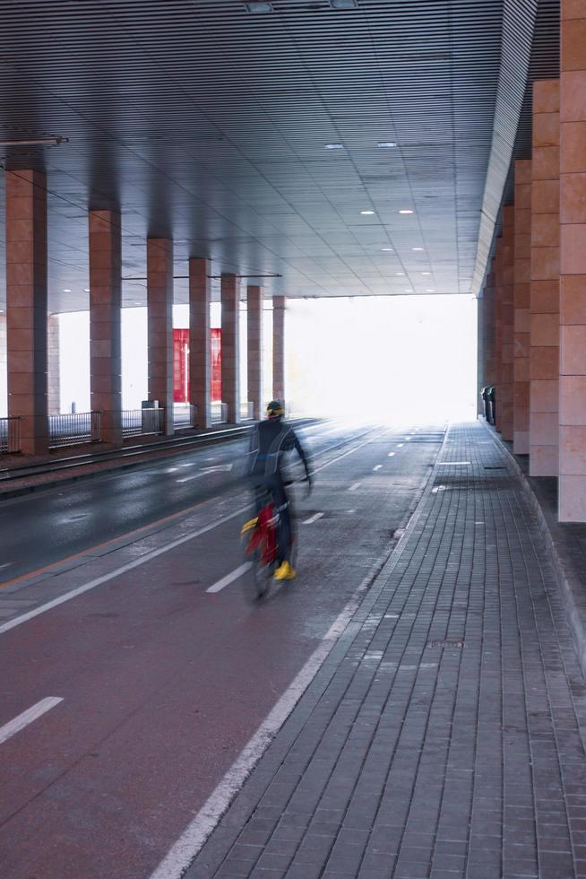 Defocused cyclist on the street in Bilbao city, Spain photo