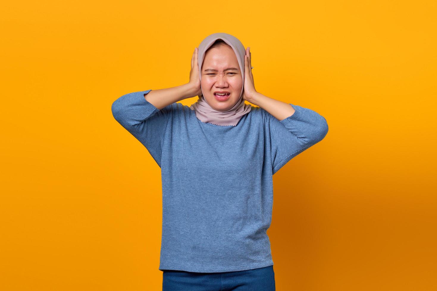 Portrait of attractive Asian woman looking stressed and worried photo