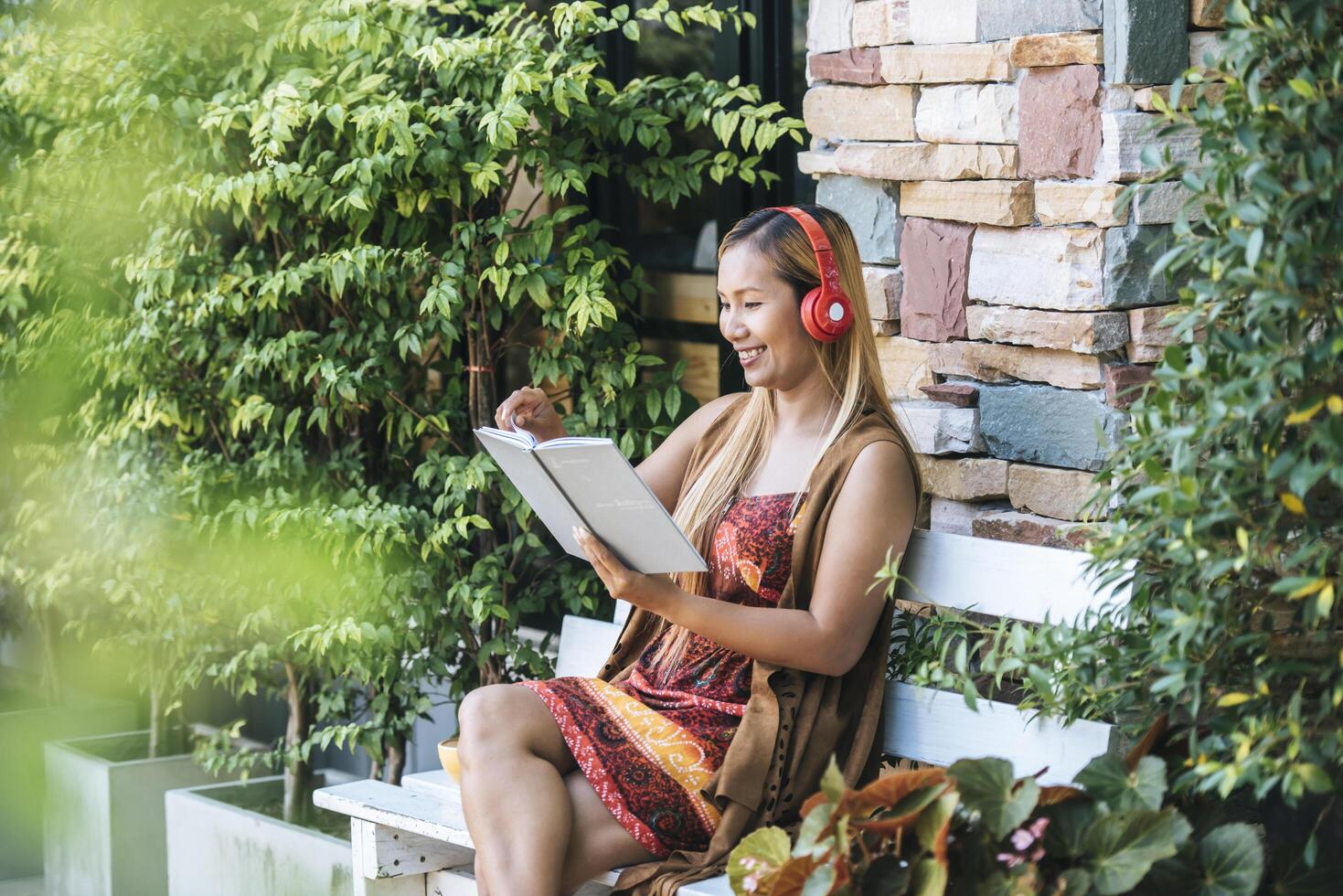 Happy young woman relax with listen favorite music at cafe photo