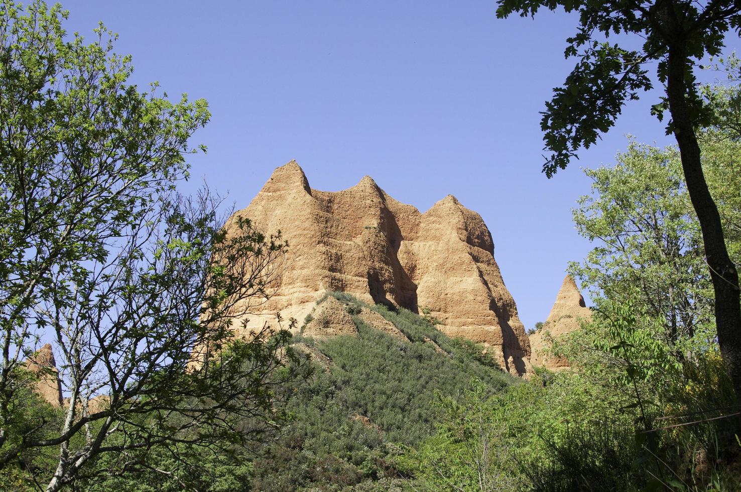 View from below of a red mountain, ancient gold mine photo