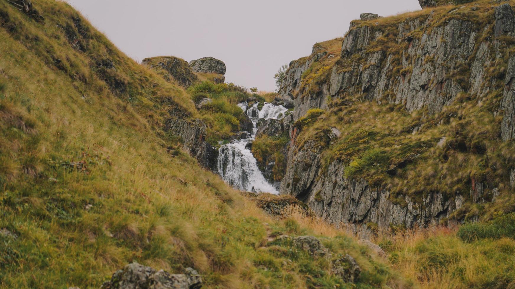 Waterfall in the mountain photo