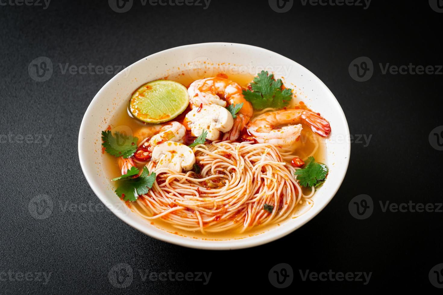 noodles with spicy soup and shrimps photo
