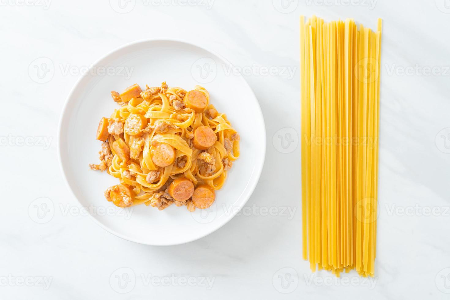 spaghetti pasta sausage and minced pork photo