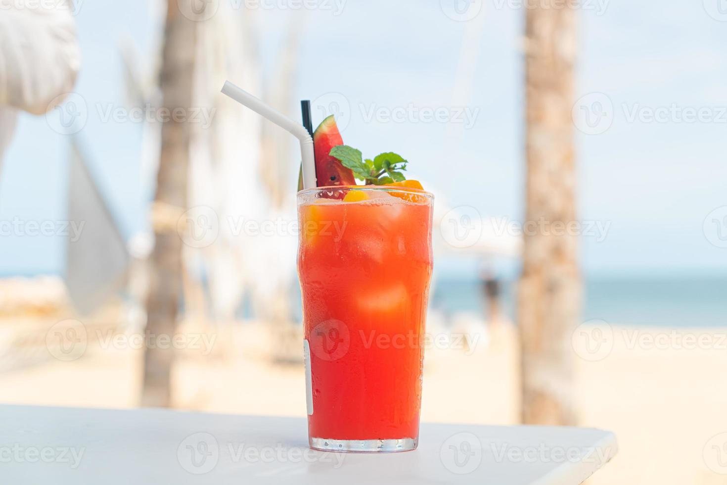 fruit punch with sea beach background photo