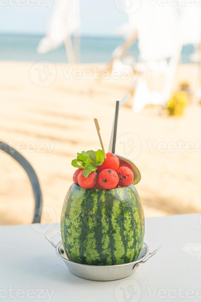 watermelon smoothies with sea beach background photo