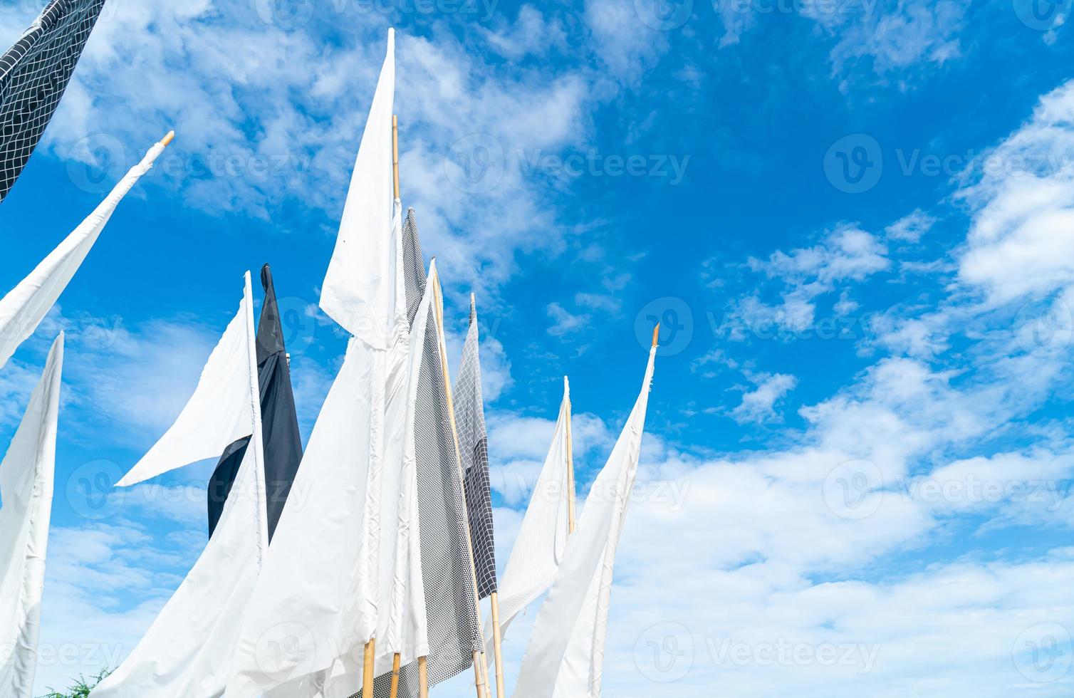 white flag with blue sky photo