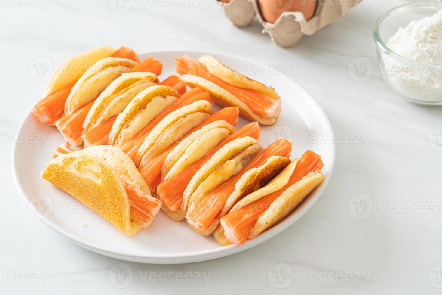 flat pancake roll with crab stick photo