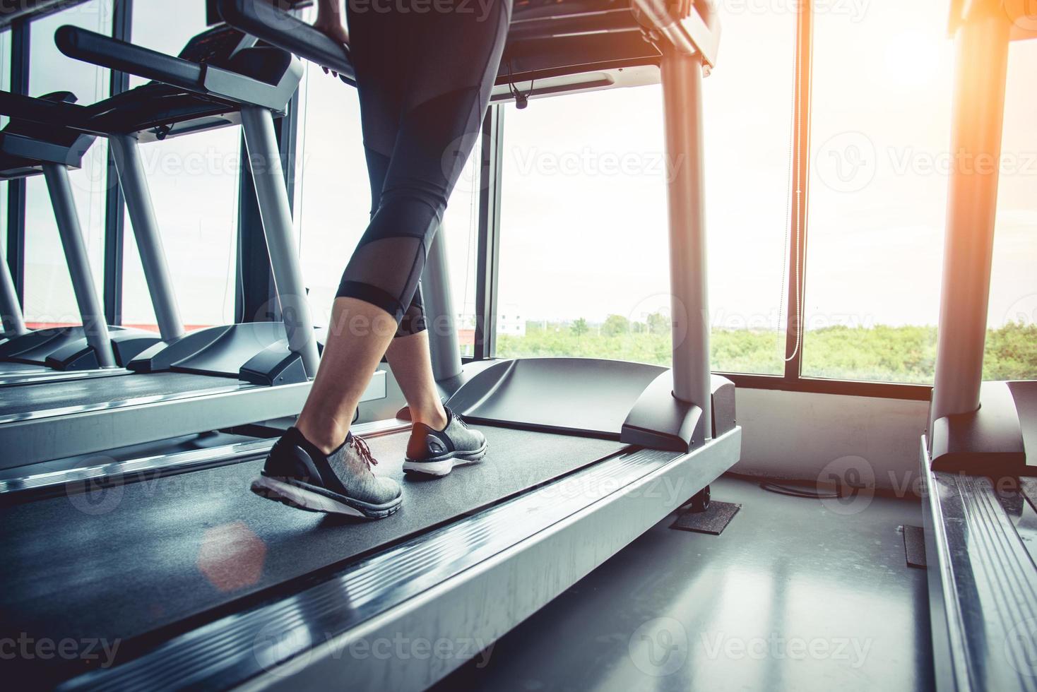 Close up of people who exercising on treadmill photo