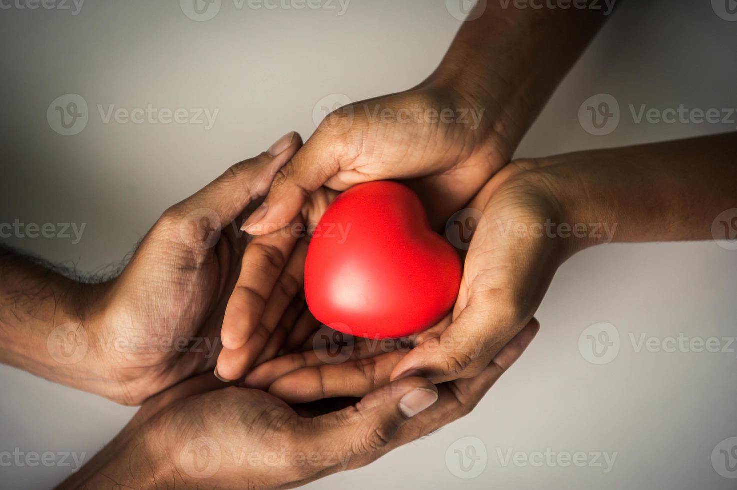 Helping hand of heart donor for patient in heart disease photo