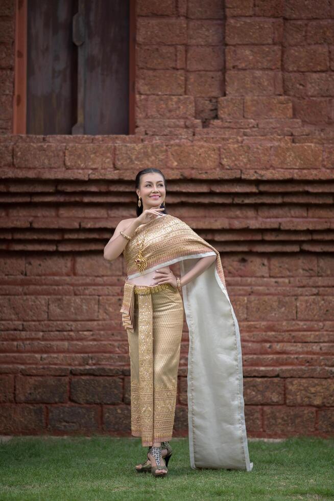 Beautiful Woman wearing typical Thai dress photo