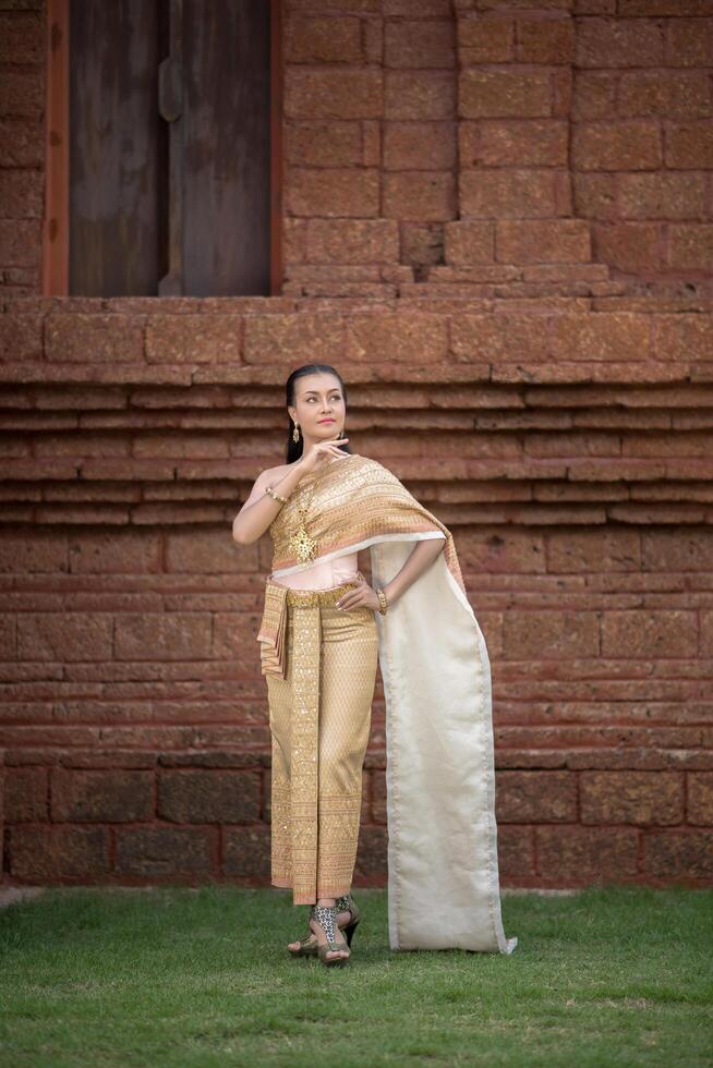 Beautiful Woman wearing typical Thai dress photo