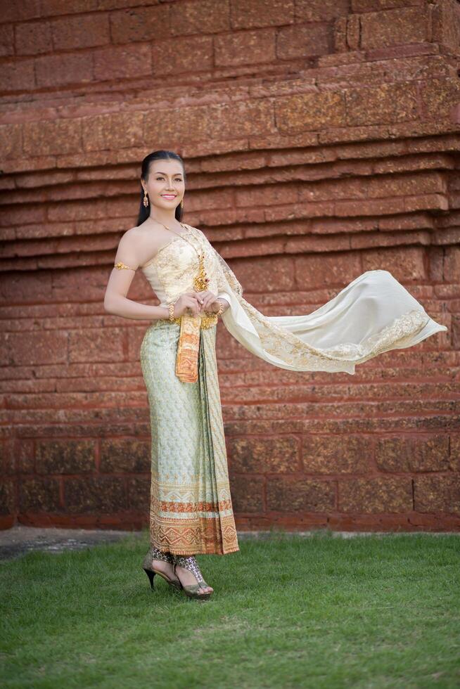 Beautiful Woman wearing typical Thai dress photo