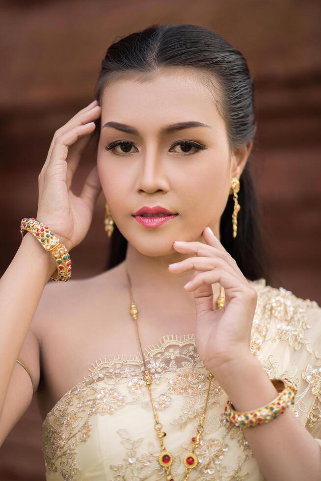 Beautiful Woman wearing typical Thai dress photo