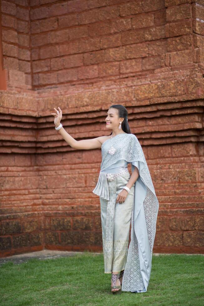 Beautiful Woman wearing typical Thai dress photo