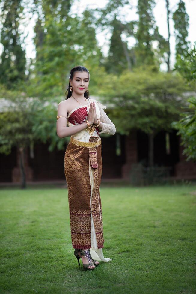 Beautiful Woman wearing typical Thai dress photo