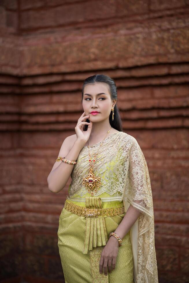 Beautiful Woman wearing typical Thai dress photo