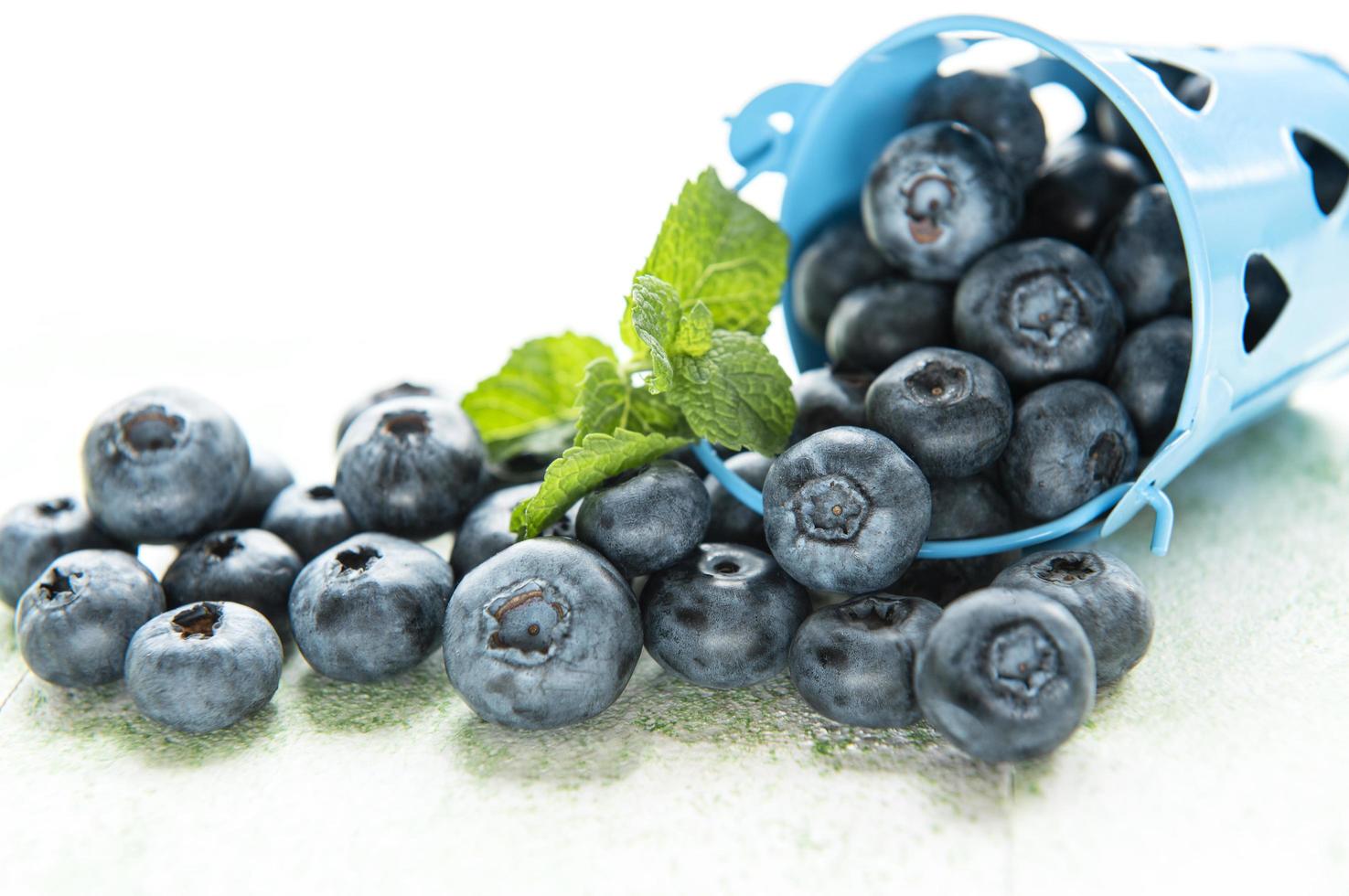 Blueberries on wooden background photo
