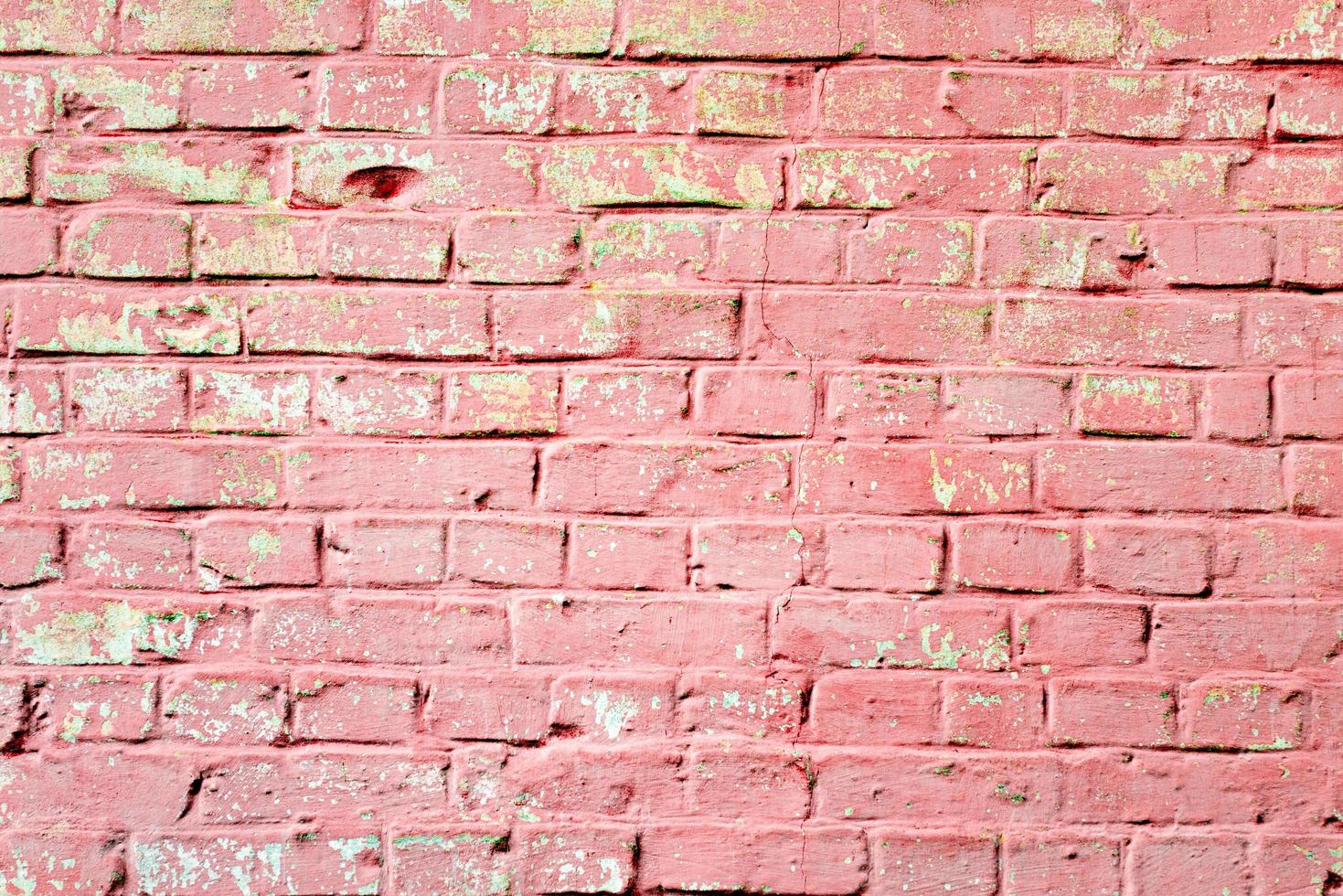 Texture of a brick wall with cracks and scratches photo