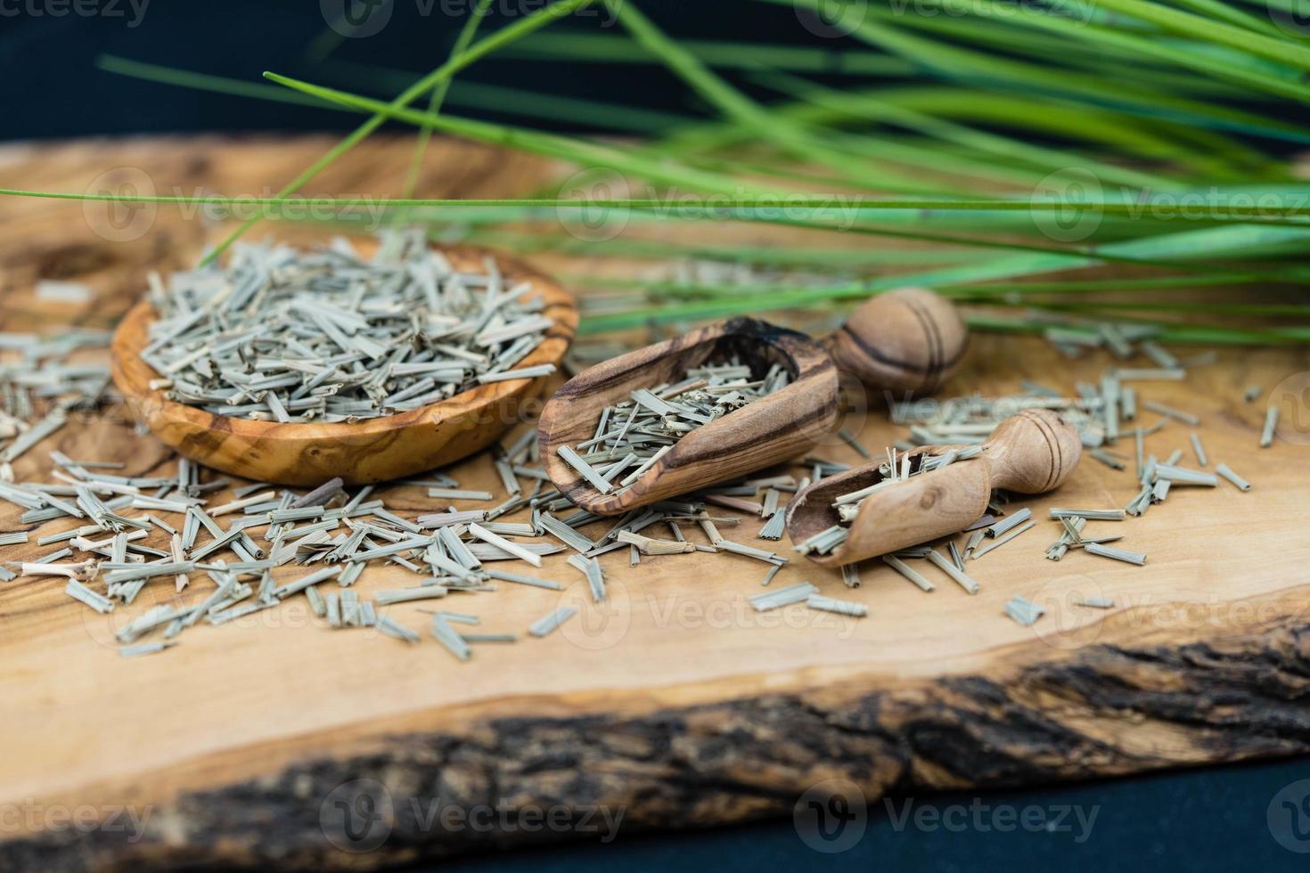 dried lemongrass on olive wood photo