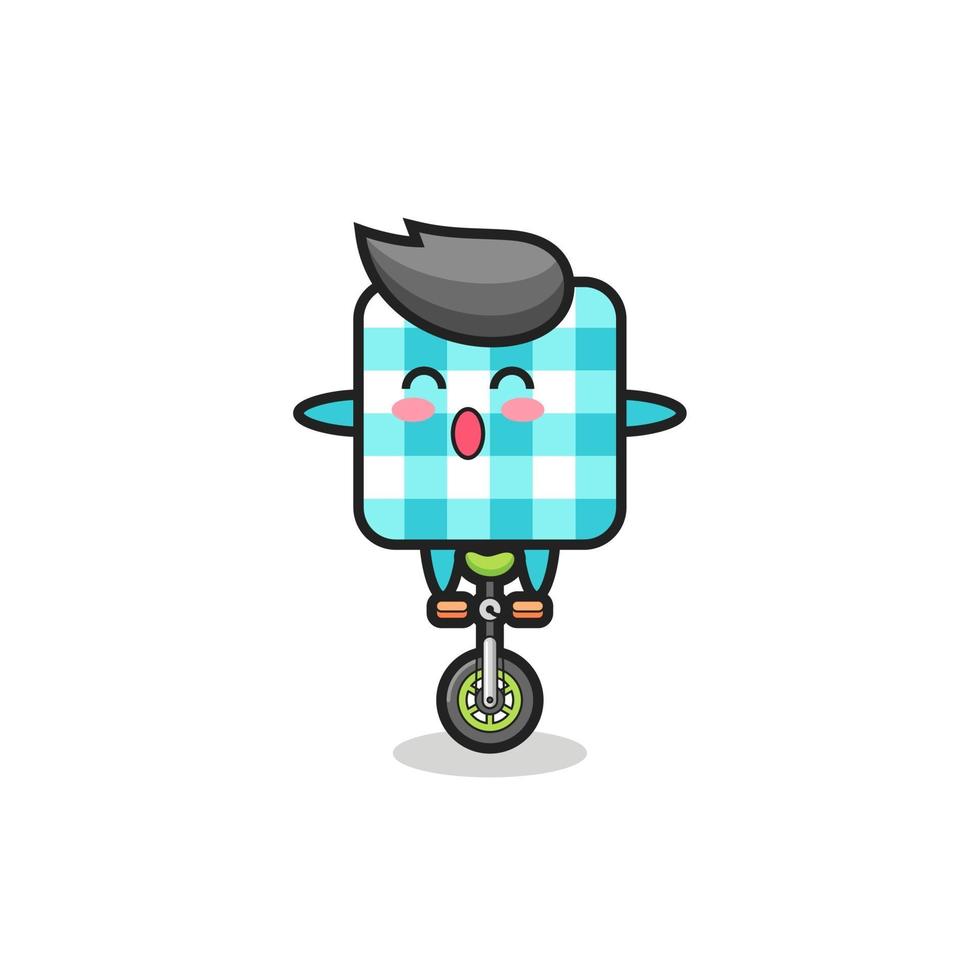 The cute checkered tablecloth character is riding a circus bike vector