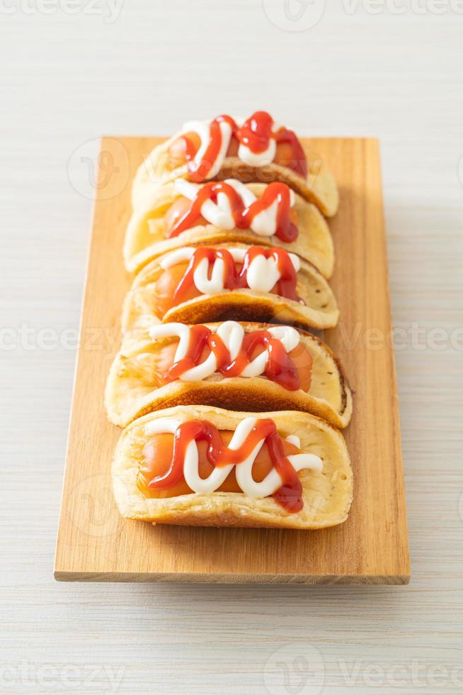 flat pancake roll with sausage photo