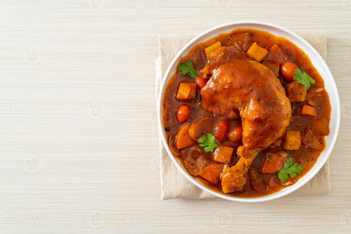 chicken stew with tomatoes, onions, carrot and potatoes photo