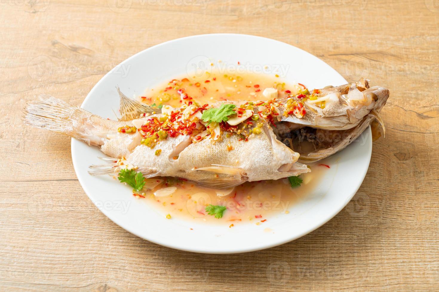 Steamed grouper fish with lime and chillies photo