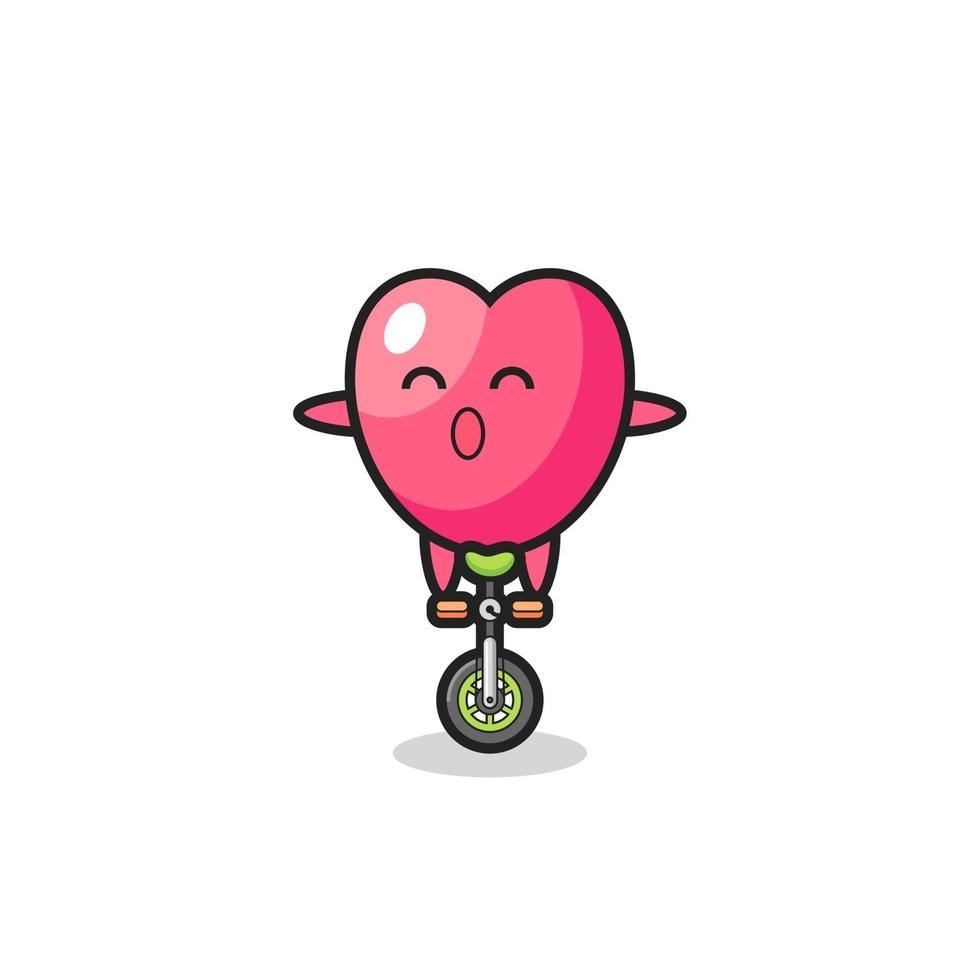 The cute heart symbol character is riding a circus bike vector