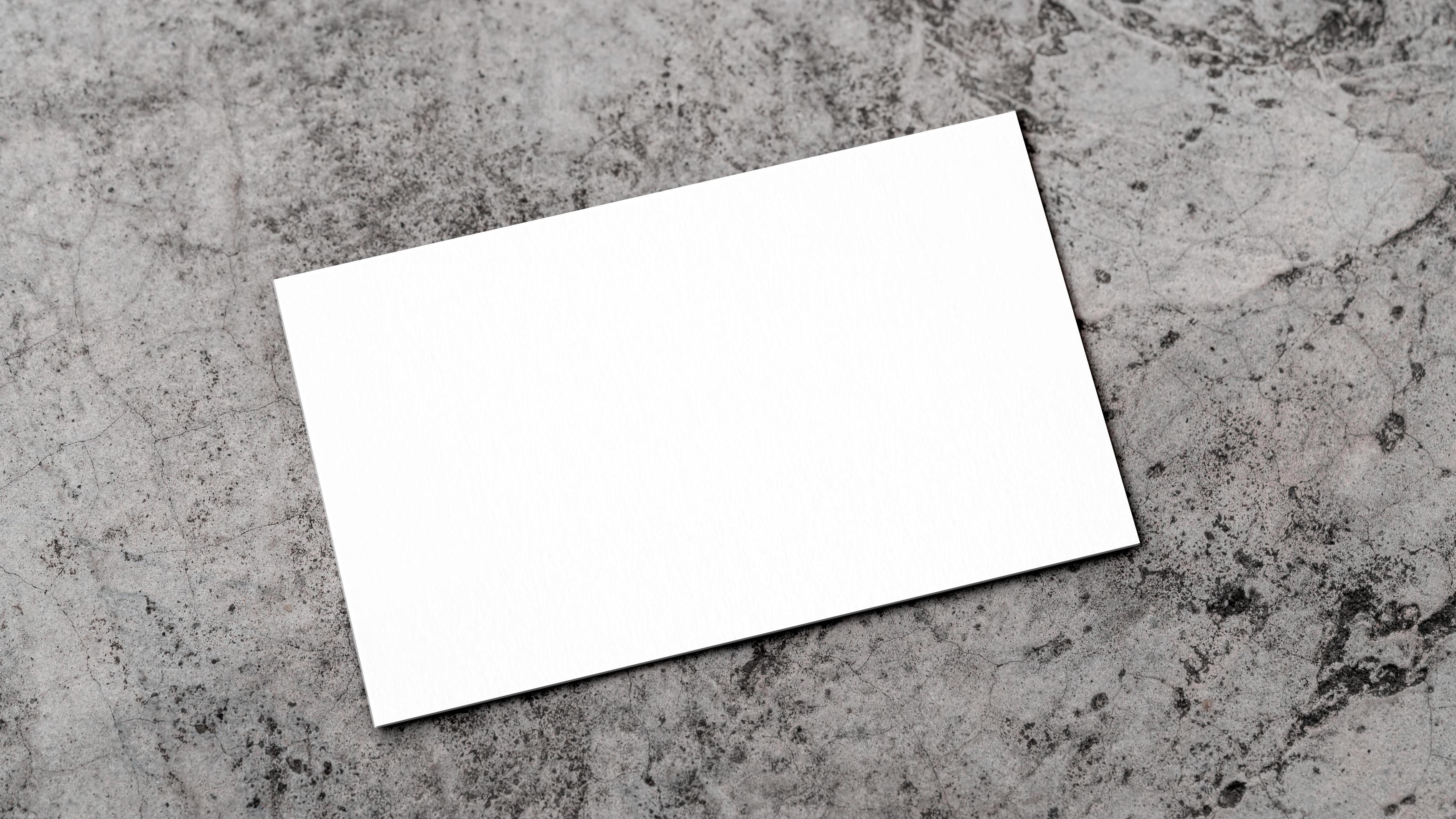 White business card on concrete for mockup photo