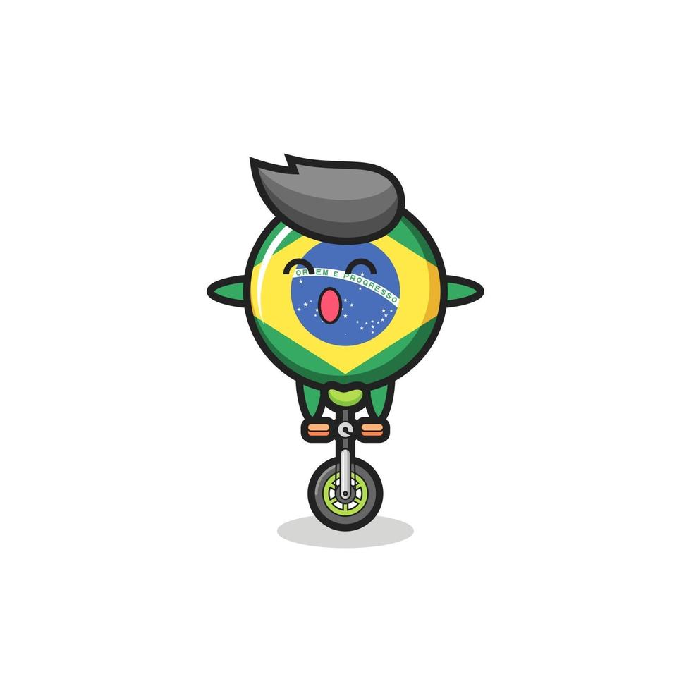 el lindo personaje de la insignia de la bandera de brasil está montando una bicicleta de circo vector