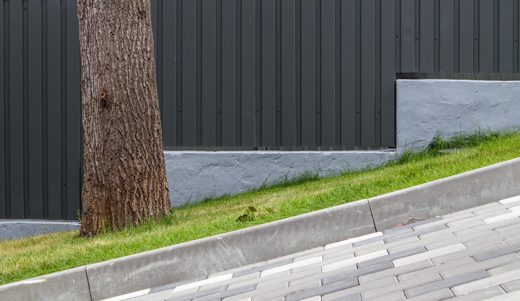 A long descent covered with gray paving slabs. photo