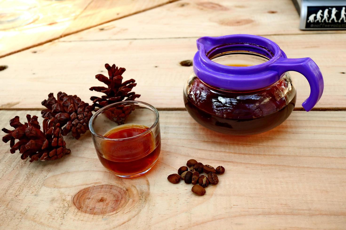 coffee drinks served on wooden tables, with added pine decorations photo